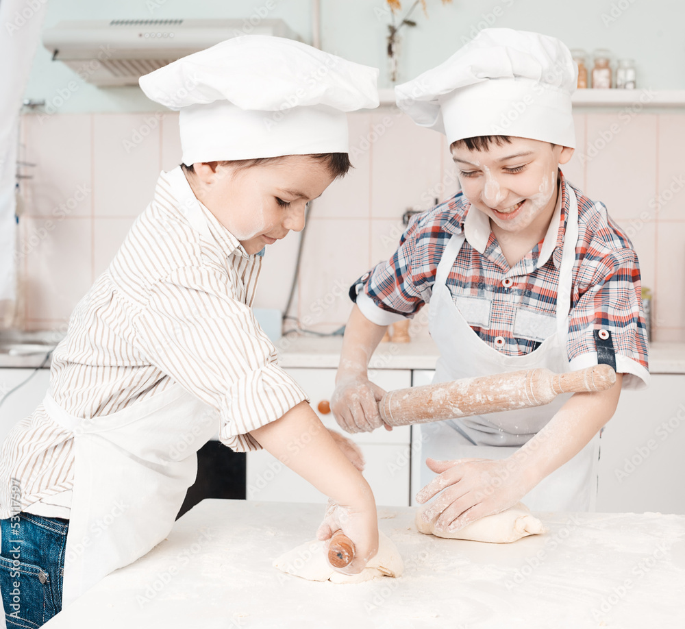 happy little chefs preparing dough in the kitchen with their happy little chefs preparing dough in the kitchen with their