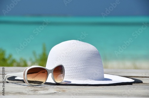 Hat and sunglasses on the wooden jetty. Exuma, Bahamas