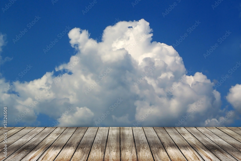 Empty wood floor and cloudy sky background