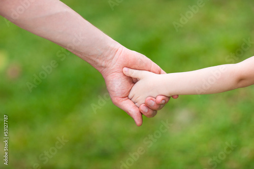 Father and daughter holding hands © BlueOrange Studio
