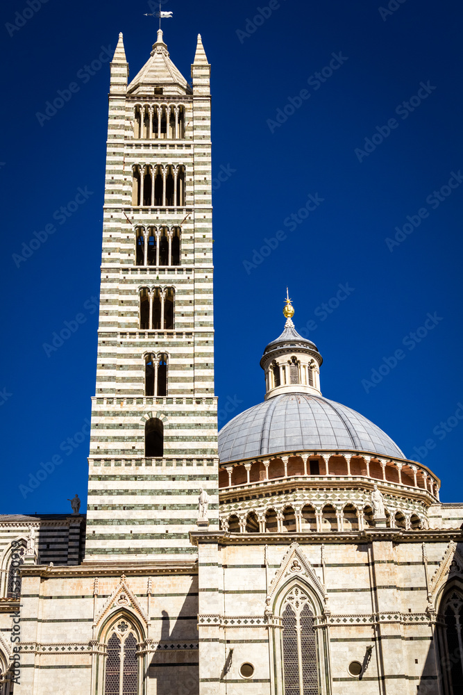 Cathedral of Siena in the summer on a blue sky background