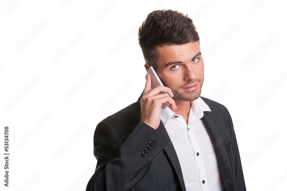 Young business man with open collar talks on mobile phone Young business man with open collar talks on mobile phone