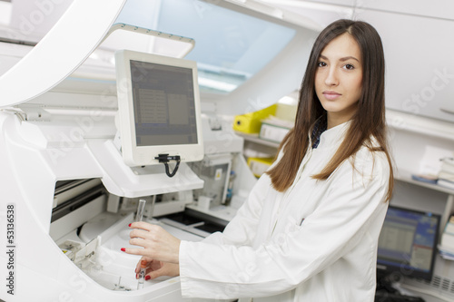 Young woman in the modern medical laboratory