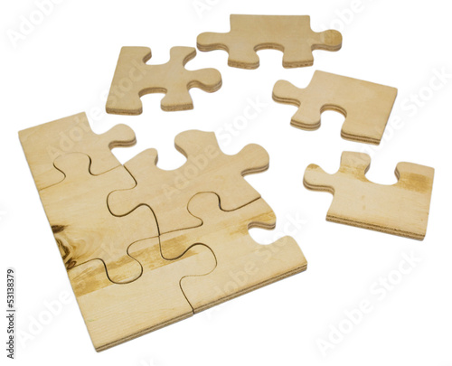 Wooden puzzle on white background.