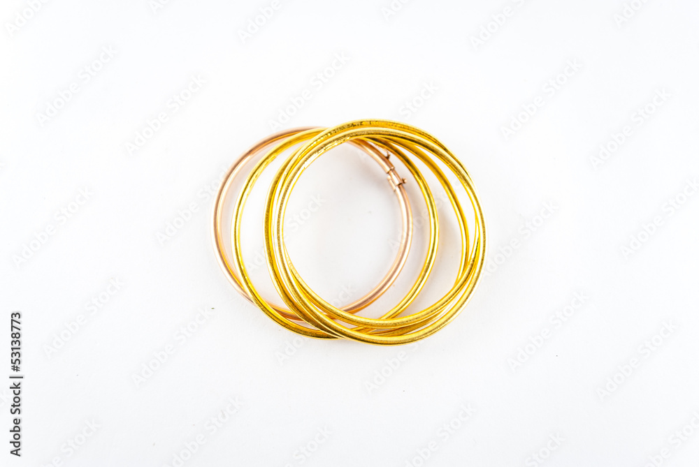 Fototapeta premium golden bracelets - bracelets isolated on the white background