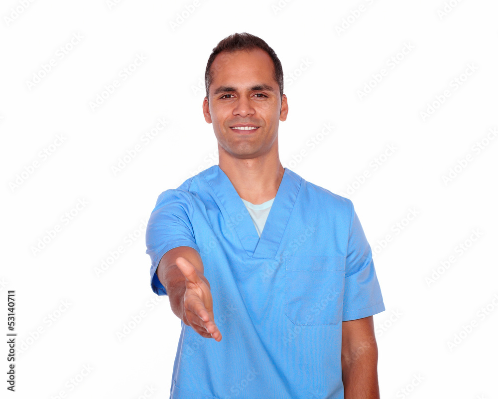 Attractive nurse gesturing a greeting with hand Attractive nurse gesturing a greeting with hand