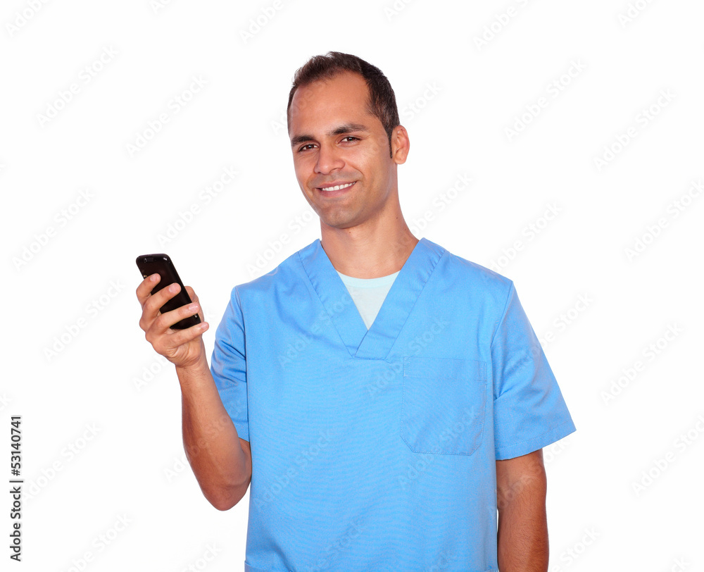 Smiling masseur sending a message on cellphone Smiling masseur sending a message on cellphone