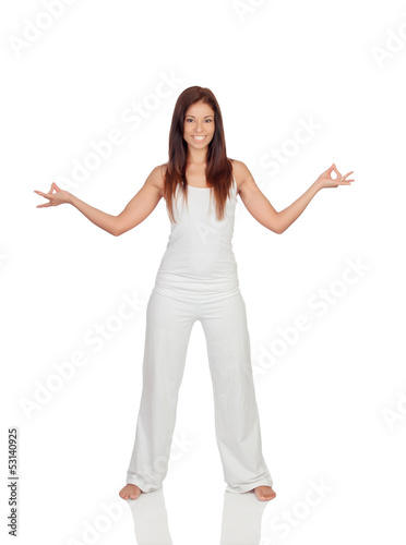Attractive girl dressed in white practicing yoga