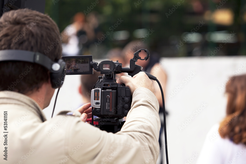 covering an event with a video camera covering an event with a video camera