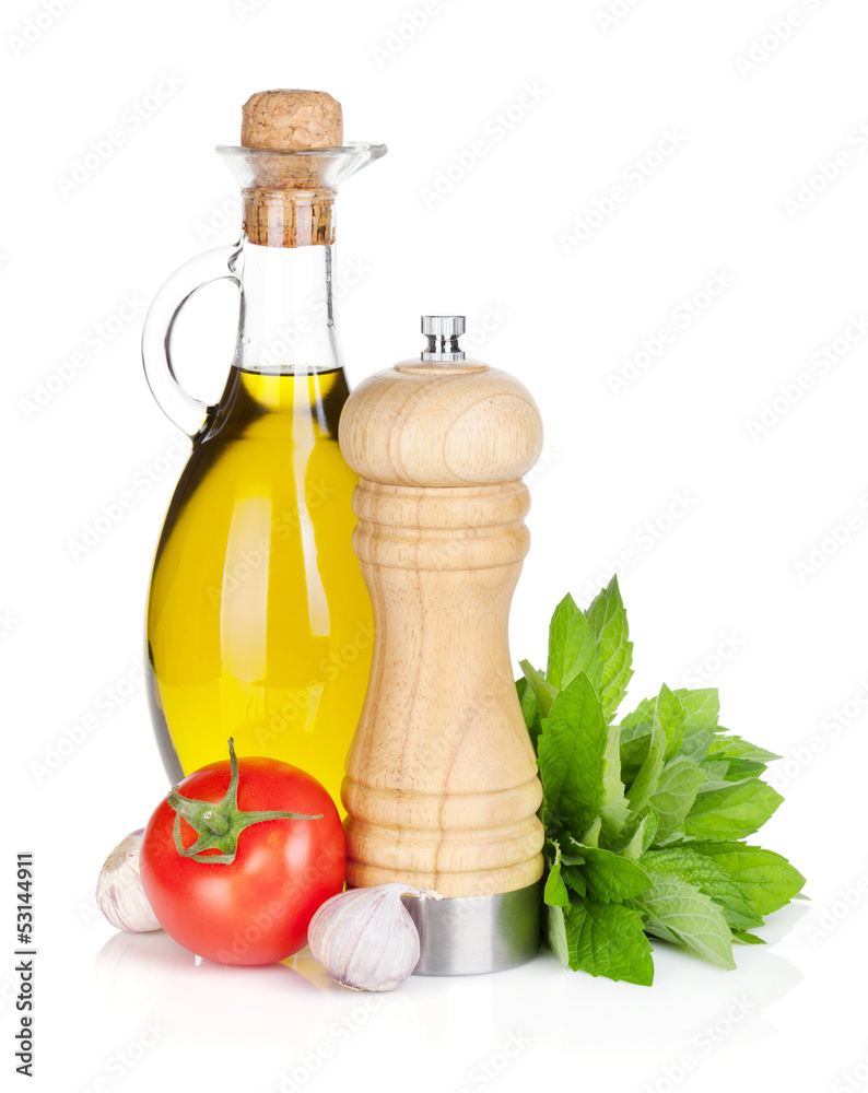 Fresh herbs, tomato, olive oil and pepper shaker Fresh herbs, tomato, olive oil and pepper shaker