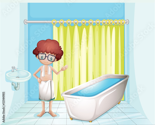 A boy standing inside the comfort room