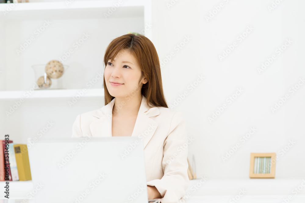 Beautiful young businesswoman working in office Beautiful young businesswoman working in office