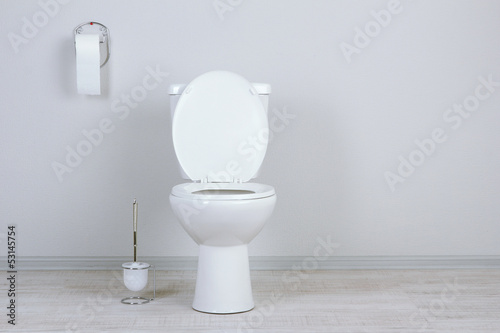 White toilet bowl in a bathroom photo