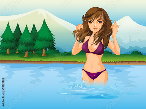 A beach with a girl wearing a purple bikini