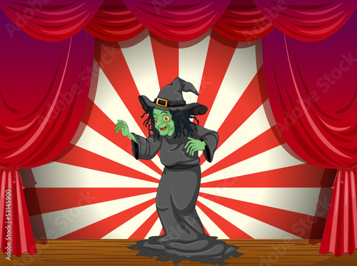 A witch standing at the stage