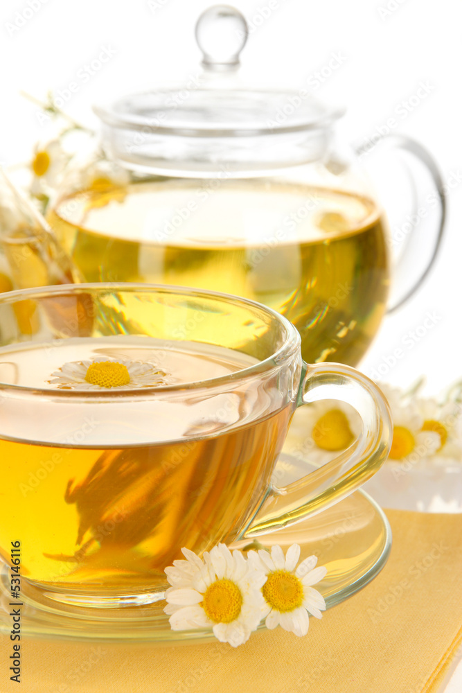 Cup of herbal tea with camomiles close up Cup of herbal tea with camomiles close up
