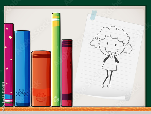 A shelf with books and a piece of paper with an image of a girl
