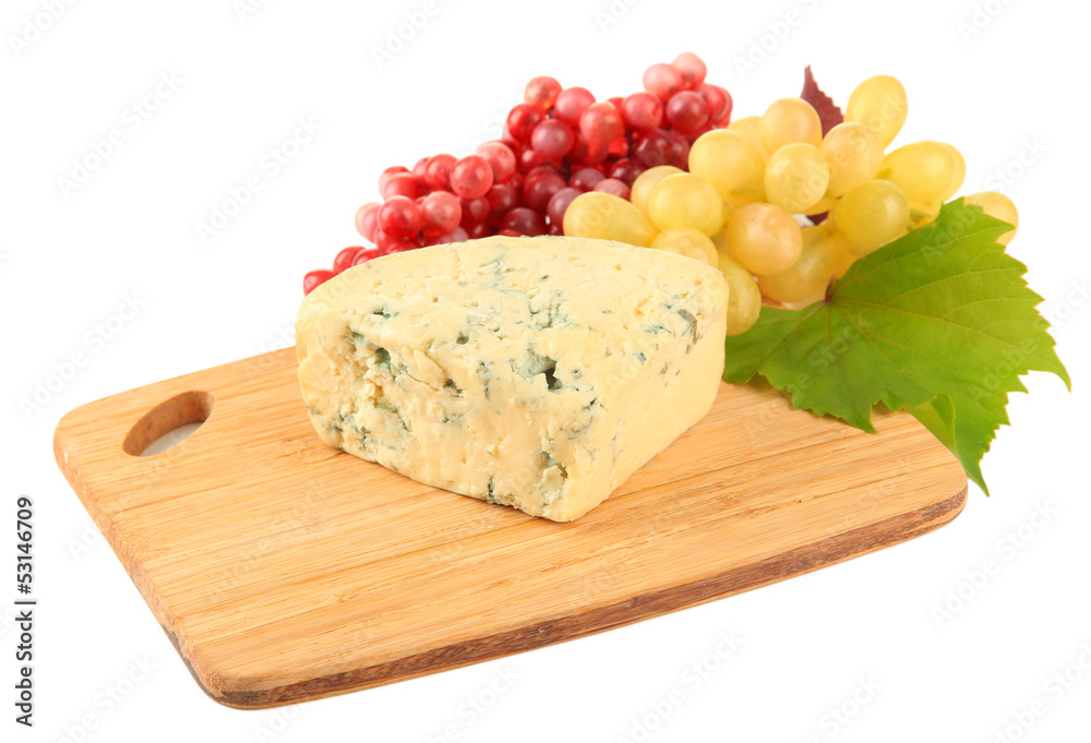 Tasty blue cheese and grape on cutting board, isolated on white