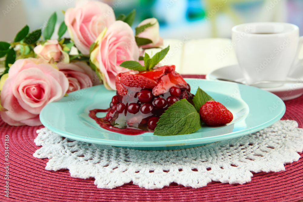 Tasty jelly dessert with fresh berries, on bright background Tasty jelly dessert with fresh berries, on bright background
