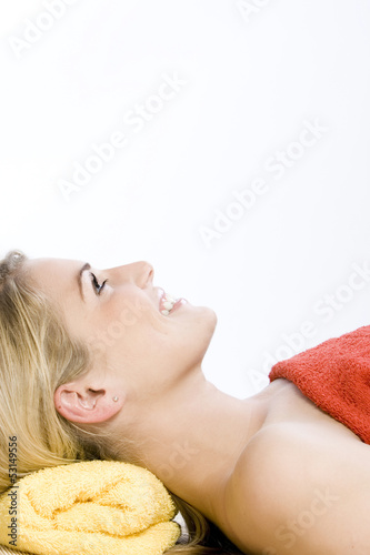 Beautiful blond woman laying and enjoying the spa