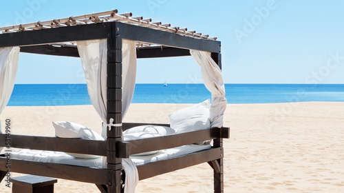 Luxurious bed by the sea, the beach to relax on vacation. Portug photo