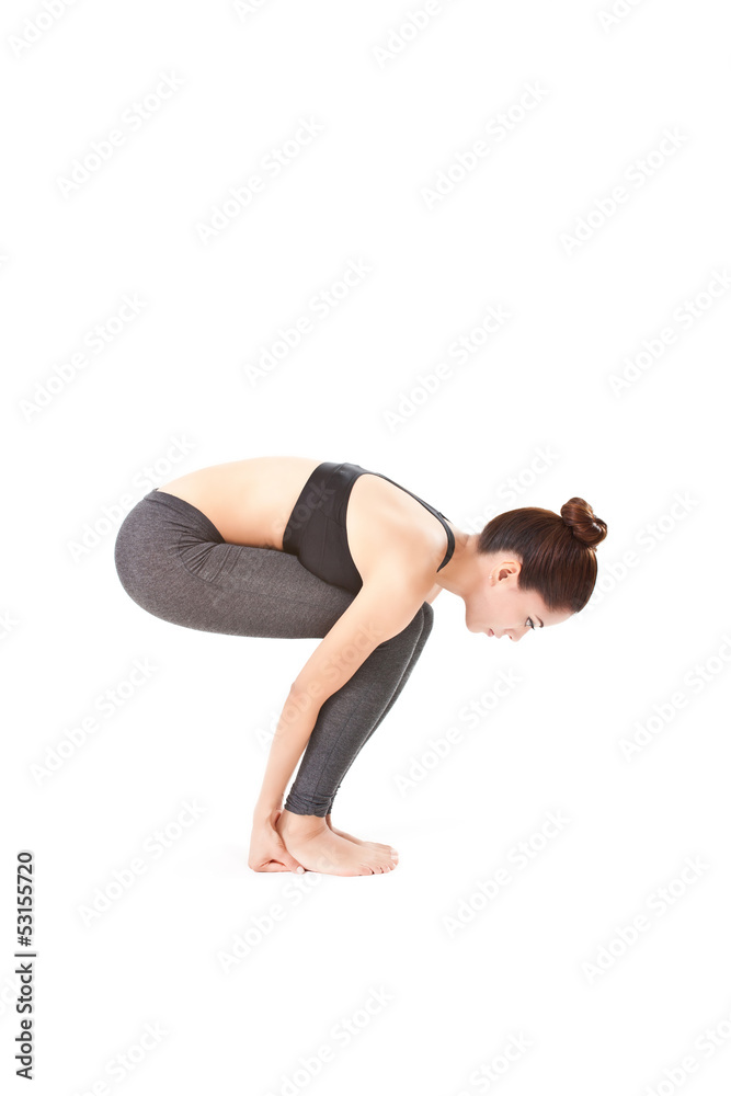 woman making a Yoga pose: Hands to Feet Pose – Pada Hasthasana woman making a Yoga pose: Hands to Feet Pose – Pada Hasthasana