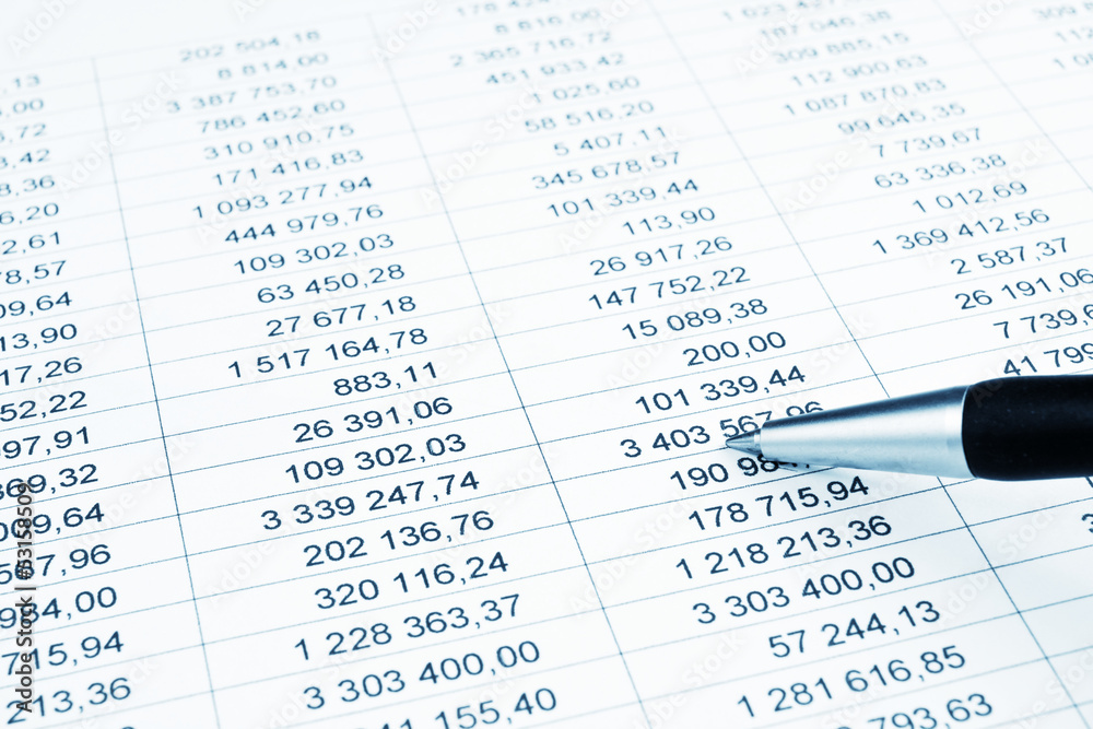 Businessman showing a diagram on a financial report using a pen Businessman showing a diagram on a financial report using a pen