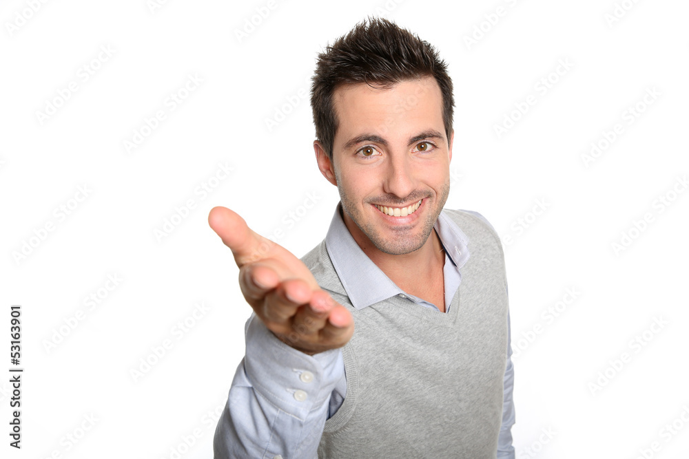 Handsome man pointing hand towards camera Handsome man pointing hand towards camera
