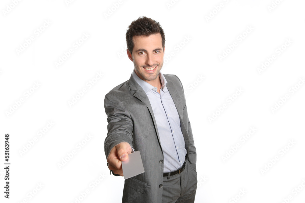 Businessman giving business card to client Businessman giving business card to client