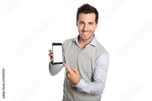 Smiling man pointing at smartphone screen photo