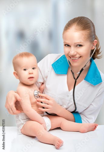 baby and doctor pediatrician. doctor listens to the heart with s