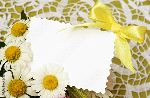 Bouquet of daisies with a card