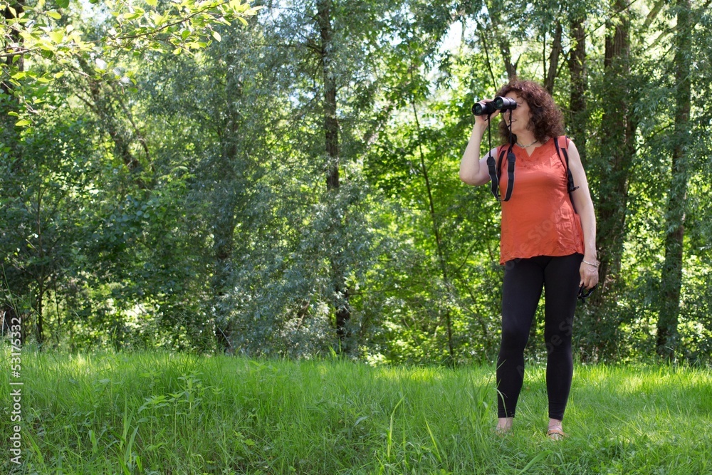 Woman watching wildlife Woman watching wildlife