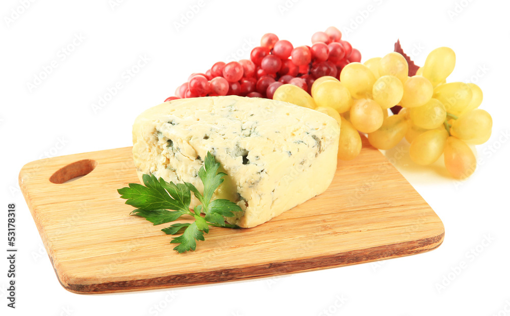 Tasty blue cheese and grape on cutting board, isolated on white Tasty blue cheese and grape on cutting board, isolated on white
