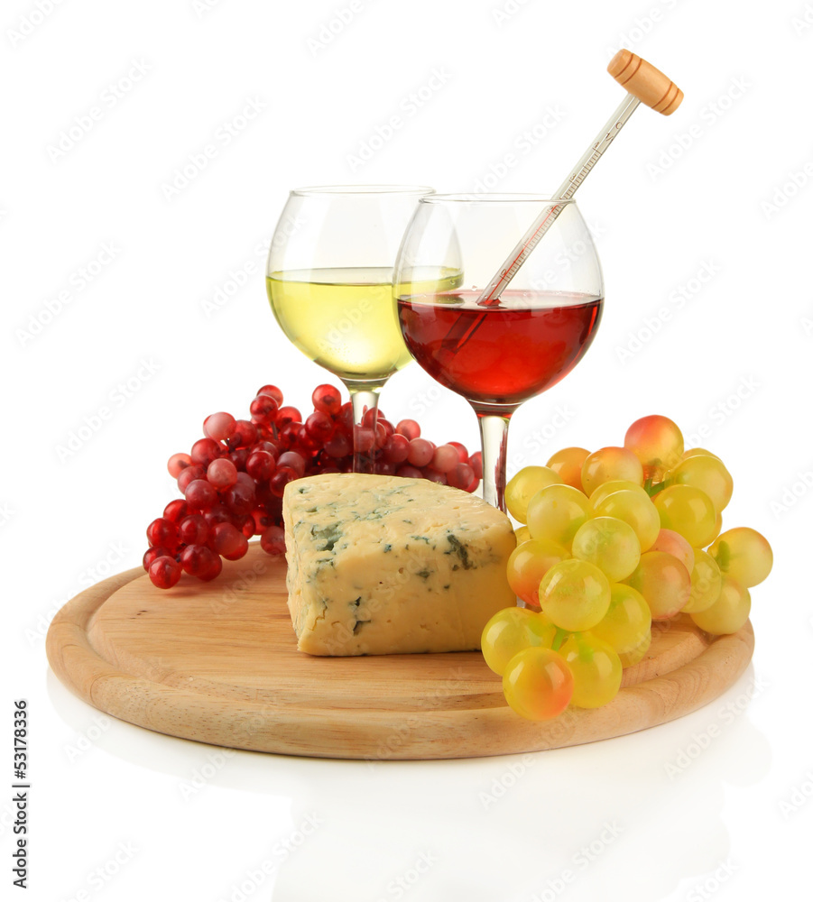 Glasses of wine, tasty blue cheese and grape
