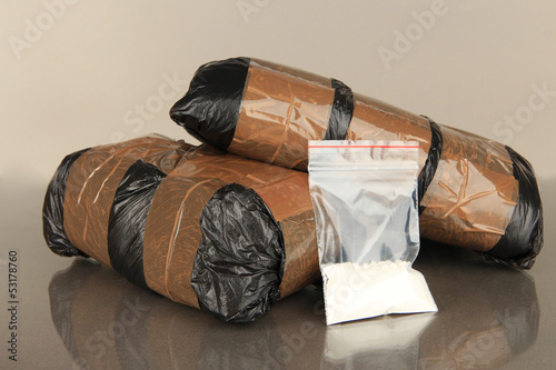 Packages of narcotics on gray background