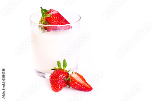 Fresh yougurt in a glass with strawberry isolated on white