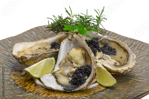 Oysters with black cavair photo