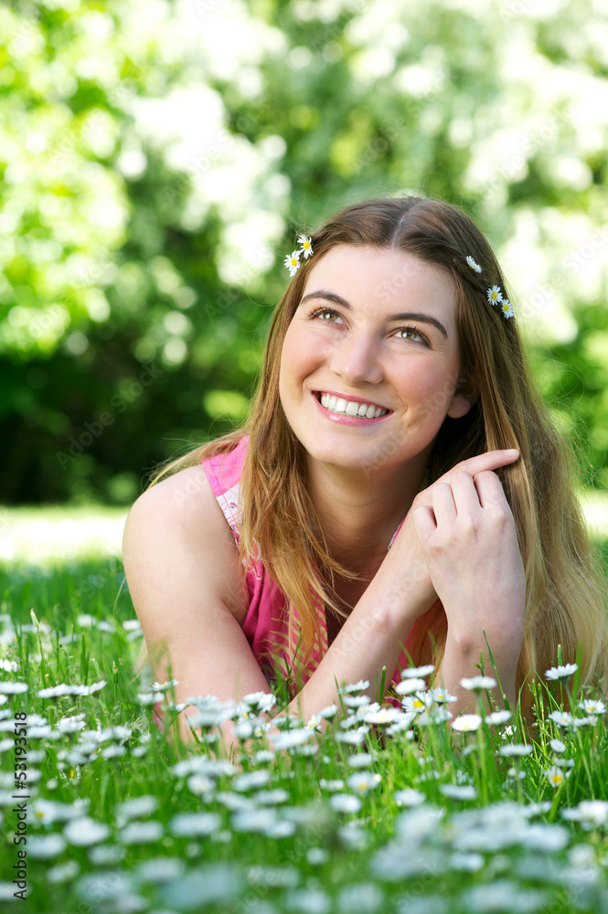 Beautiful young woman smiling outdoors