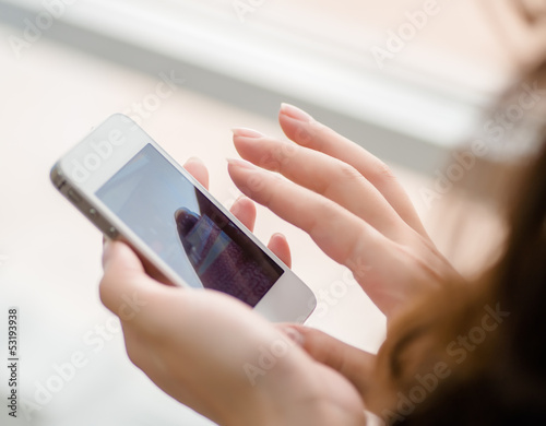 woman uses a smartphone