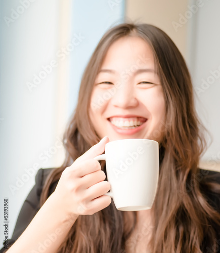 young girl with a cup