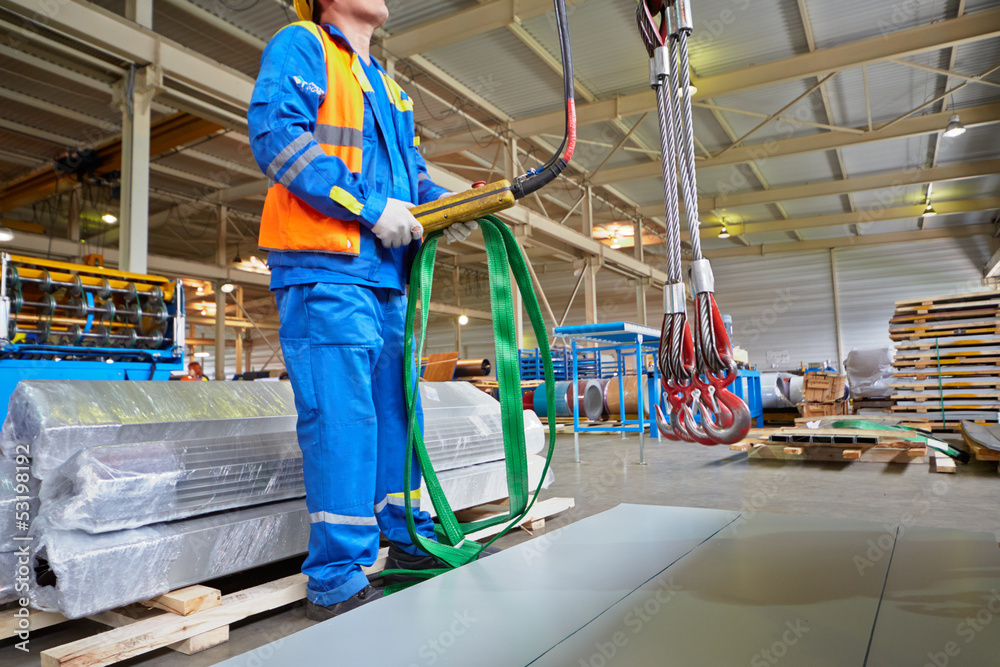 Workers operates crane-beam Workers operates crane-beam
