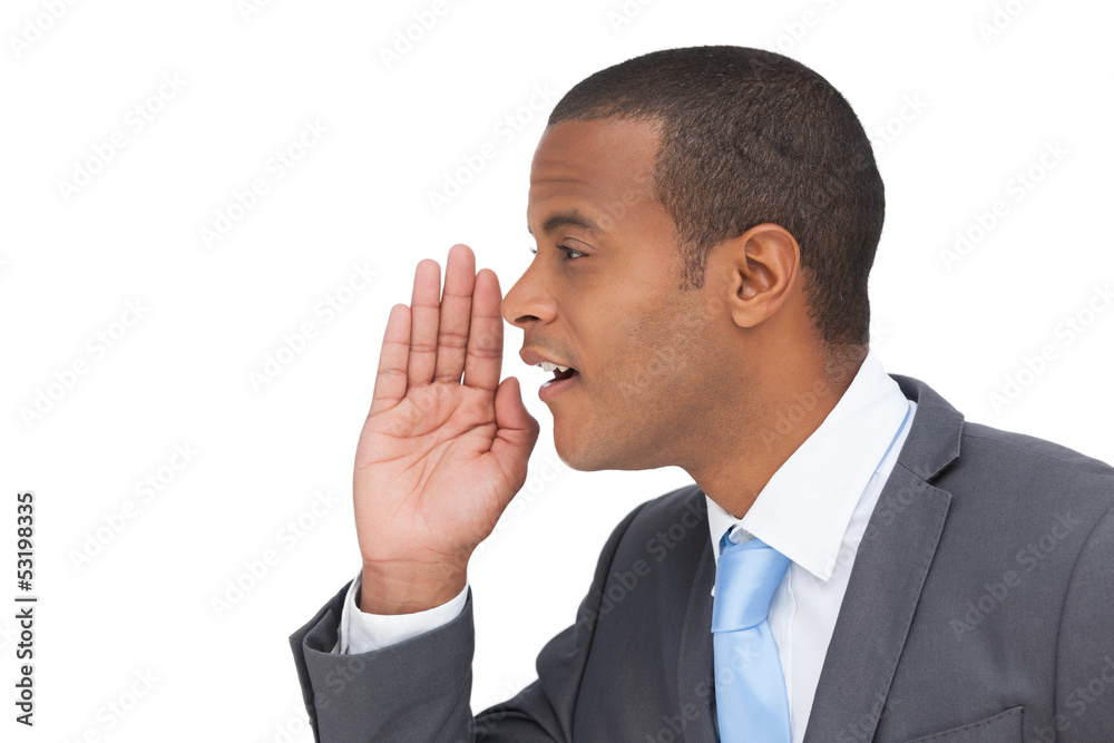 Profile view of a businessman calling for someone Profile view of a businessman calling for someone