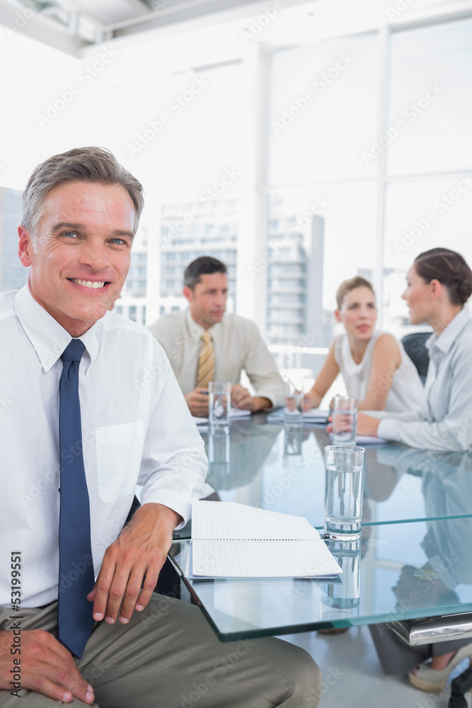 Obraz premium Smiling businessman during a meeting