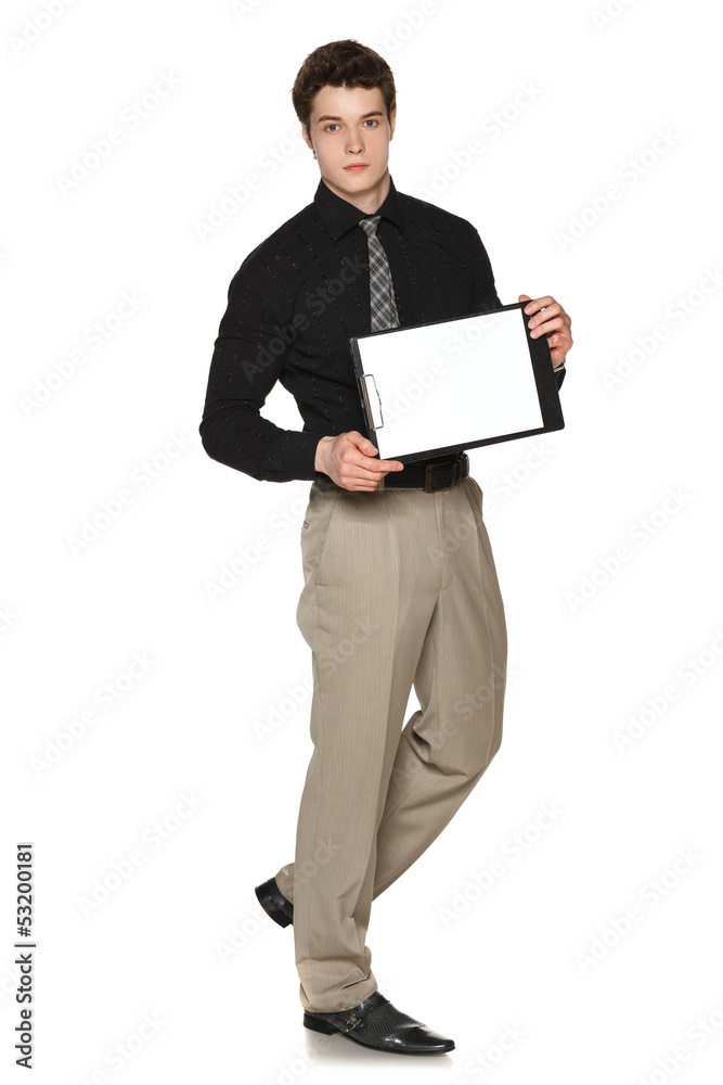 Young serious businessman showing blank clipboard Young serious businessman showing blank clipboard