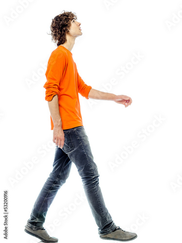 young man walking  looking up side view