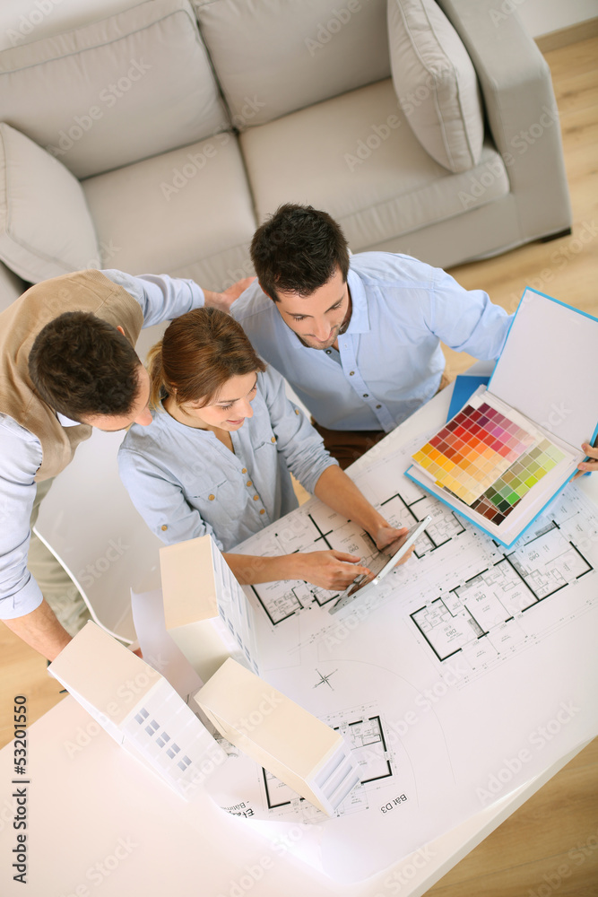 Upper view of architects working in office Upper view of architects working in office
