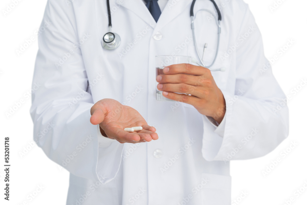 Doctor holding drugs and glass of water Doctor holding drugs and glass of water