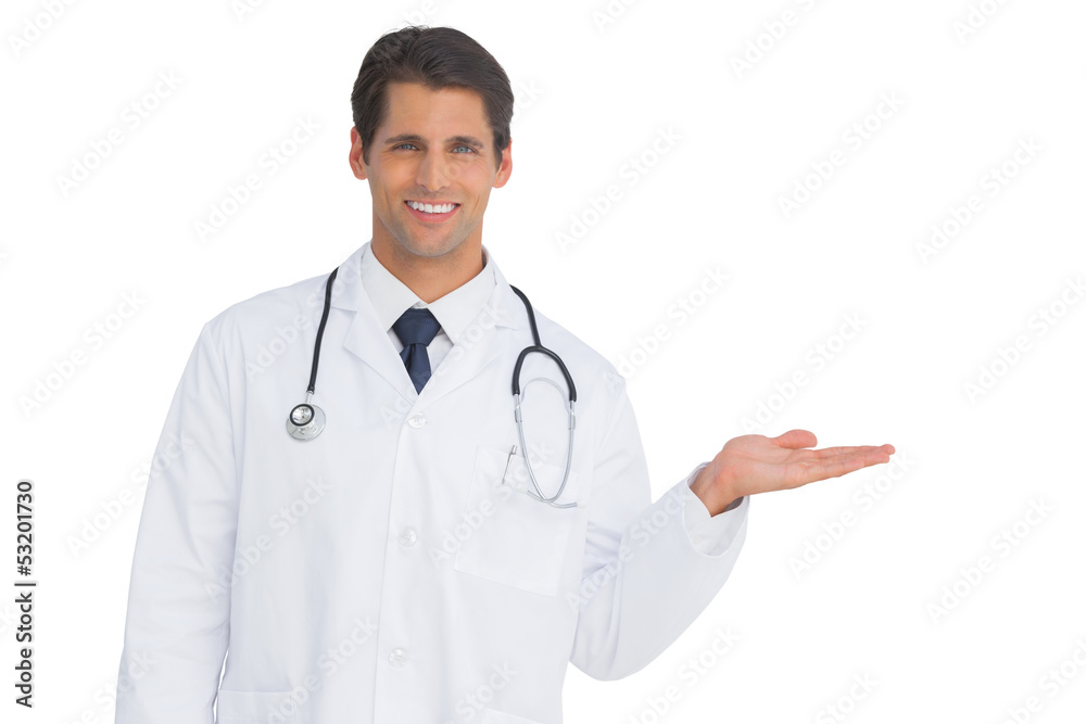Happy doctor showing something and smiling Happy doctor showing something and smiling