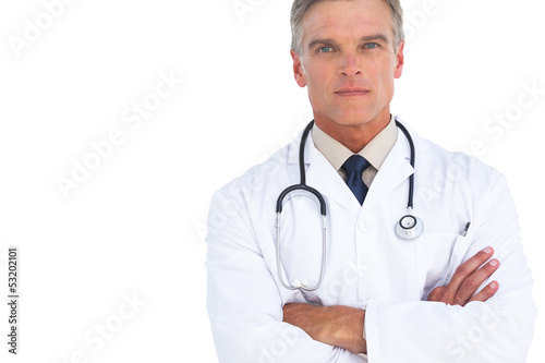 Serious man doctor with arms crossed
